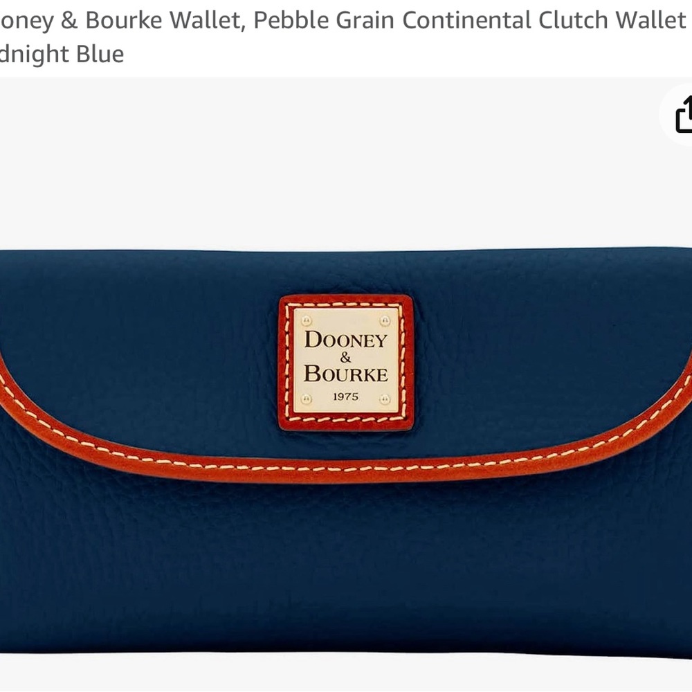 Dooney & Burke women’s wallet. Never used. Too small for me.